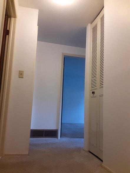 Upstairs hallway to main bathroom and 3 bedrooms - 8258 Larkspur Dr