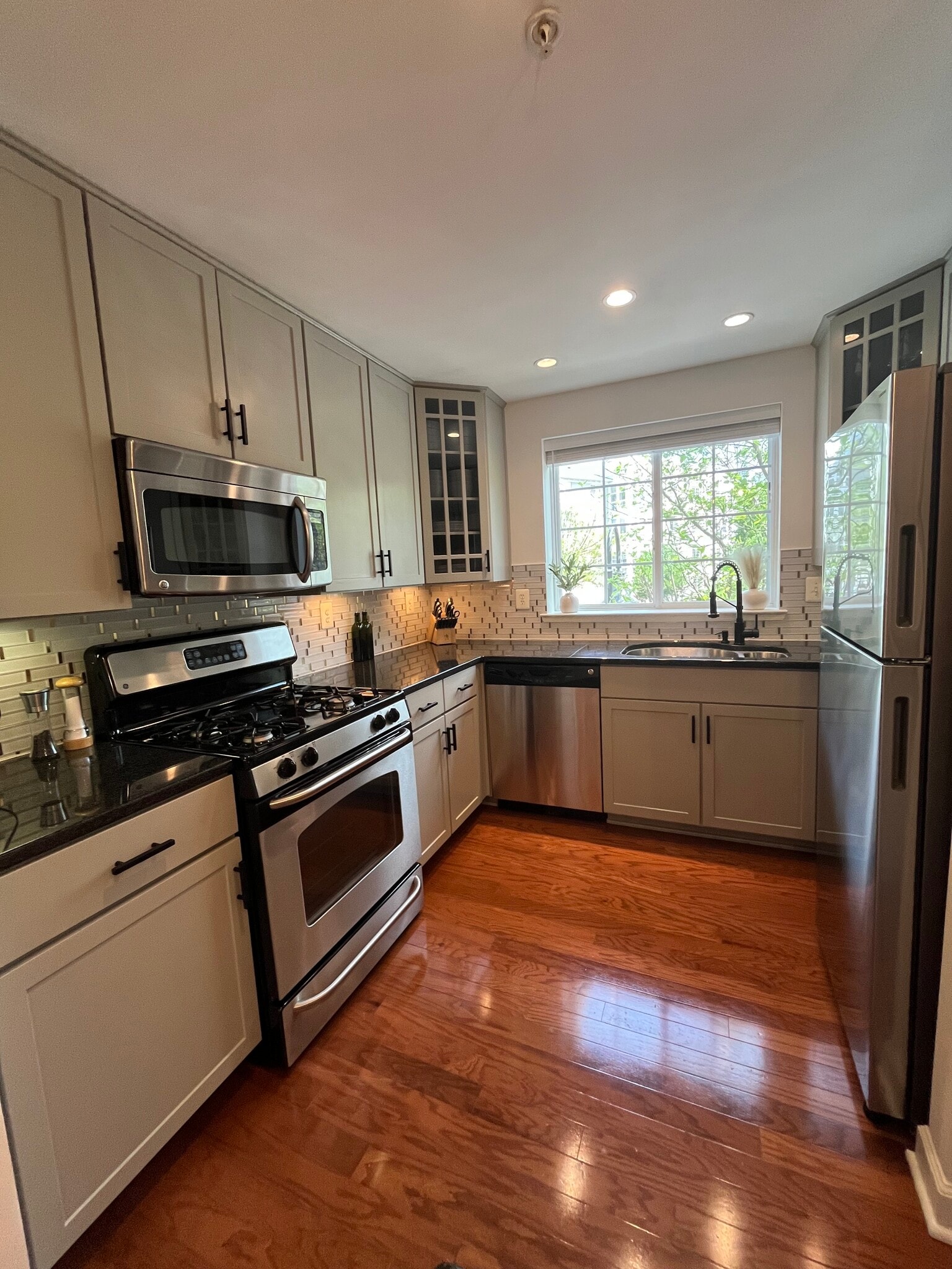 Modern kitchen with stainless steel appliances and tons of counter space. - 4079 S Four Mile Run Dr