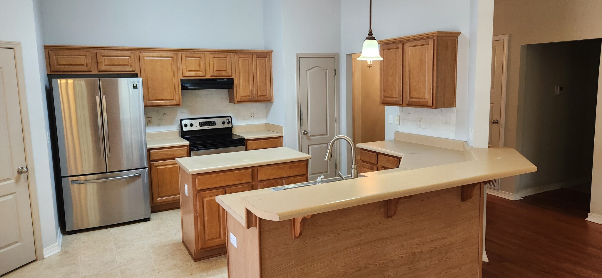 Kitchen sink and island - 2318 Tall Oak Dr