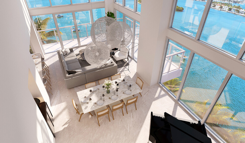 Double-height windows usher in fantastic Biscayne Bay views. - Flamingo Point