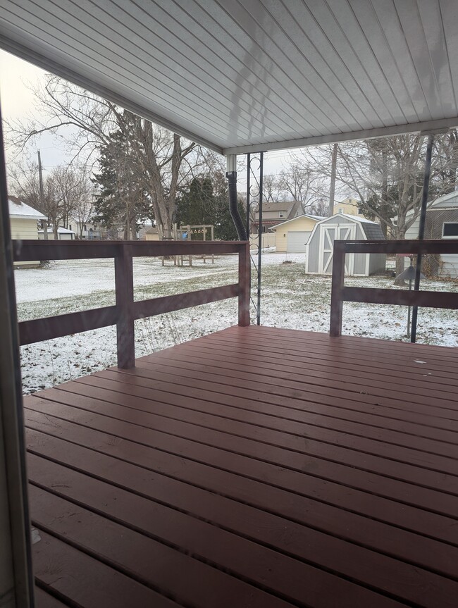 A covered deck off the dining room ensures outside enjoyment in every season. - 910 Maple St