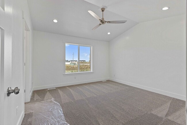 Building Photo - NEW HOME with large garage stalls and unfinished basement for additional storage