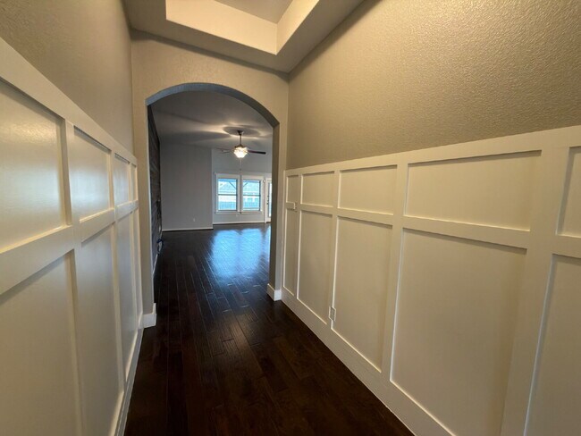 Building Photo - Four bed two bath on a corner lot with a pool in Sunfield. Gas cook top, double ovens. Open kitch...