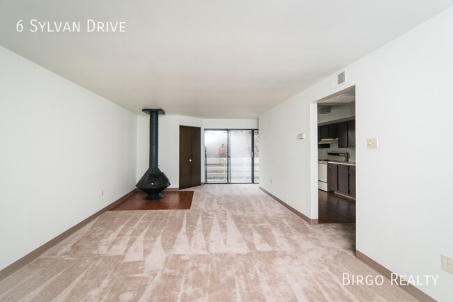 Building Photo - Warm up next to the fire in this 2 bedroom...