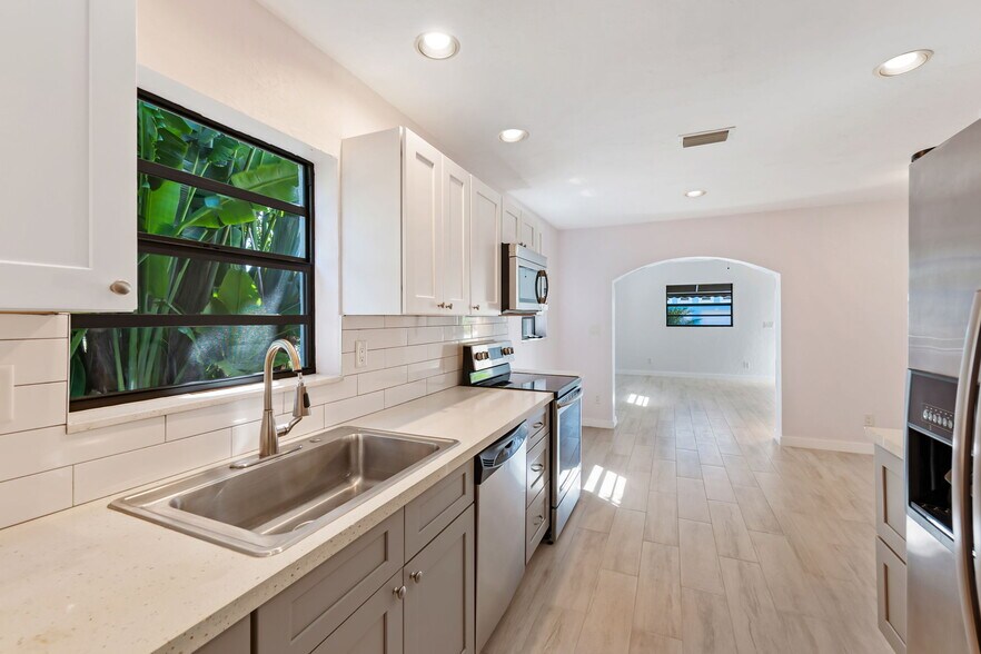 kitchen with stainless steel appliances - 3275 Cottage Grove Ave