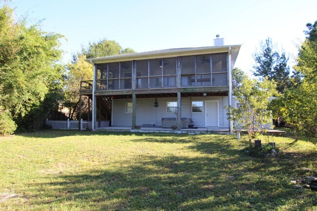 Building Photo - Live the Gulf Breeze Waterfront Life – Dock, Canal Access & Boat Lift!