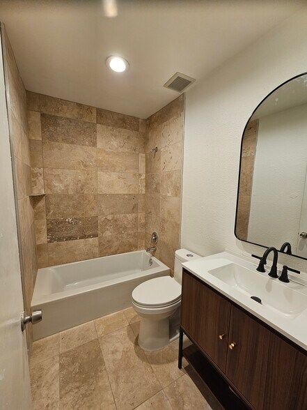 New Bathroom with Soaker Tub and Natural tile - 2605 Arkansas Ave