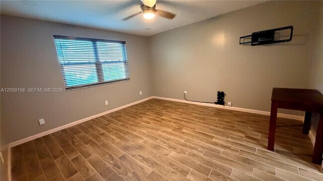 Building Photo - 6090 N Sabal Palm Blvd