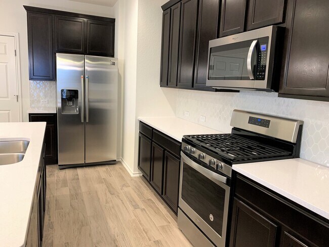 Building Photo - Home in The Village at Wells Branch