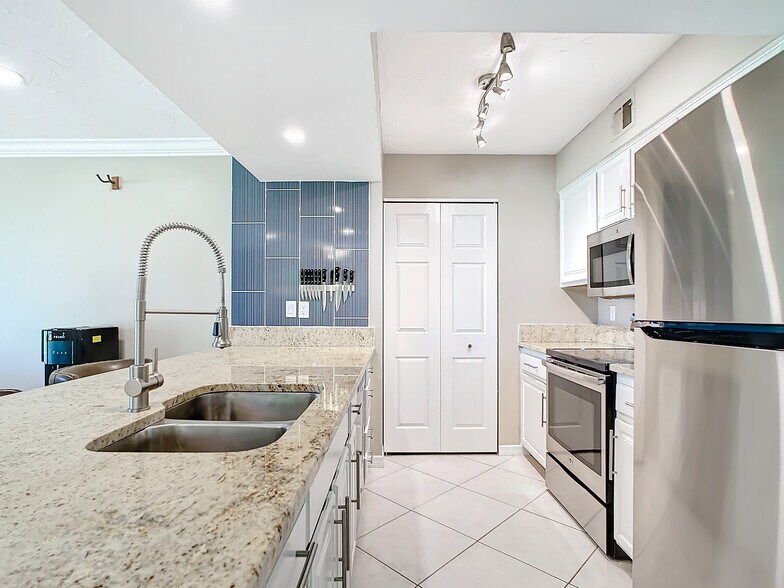 Kitchen- Granite Countertops - 2400 Feather Sound Dr Apt 421