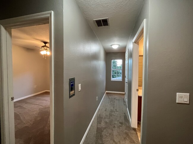 View from Hall to Back bedroom, Hall Bath and Stairs - 13155 Liberty Square Dr