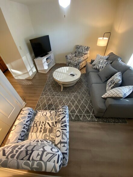 Den with ceiling fan and coat closet - 119 Michael Dr