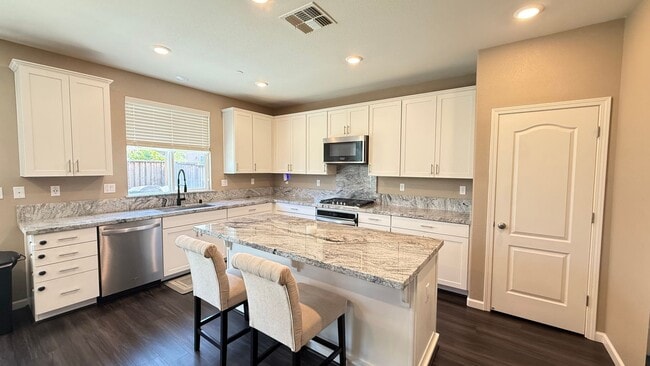 Building Photo - Spacious 5-Bedroom Home | Private Yard + Attached Garage