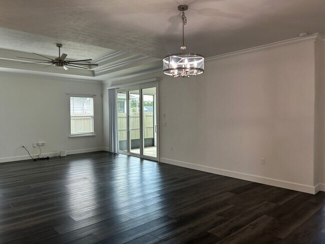 Building Photo - Immaculate 3/2 with Yard, Garage, and Pet ...