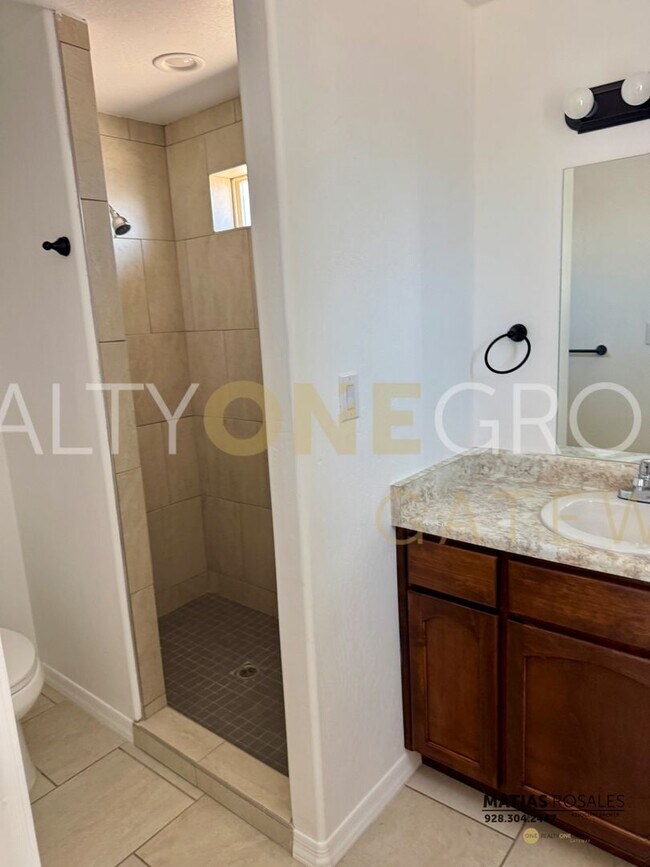 Building Photo - Three Bedroom Two Bath Home with All Tile ...