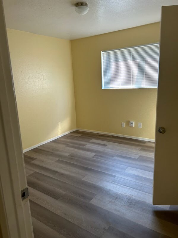 Beautiful Bedroom 1 of 2. New floors, new window treatments - 115 Lazy Ln