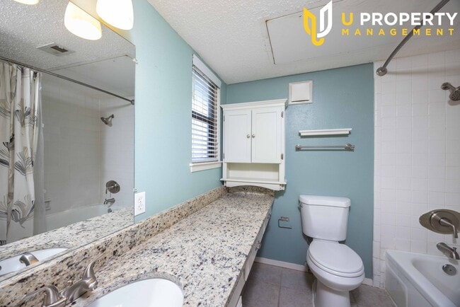 Building Photo - Updated Condo with New Vinyl Flooring & Ne...