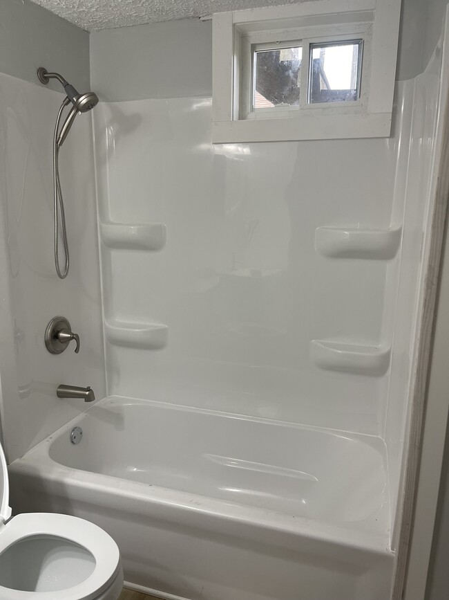 New bathtub, shower fixture and window - 834 N Elizabeth St