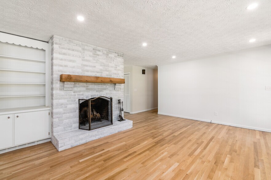 Fireplace/Family Room-Hall to Bedrooms - 4397 Limerick Ln