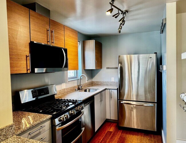 Building Photo - Corner Light. City Energy. Zero Compromise.