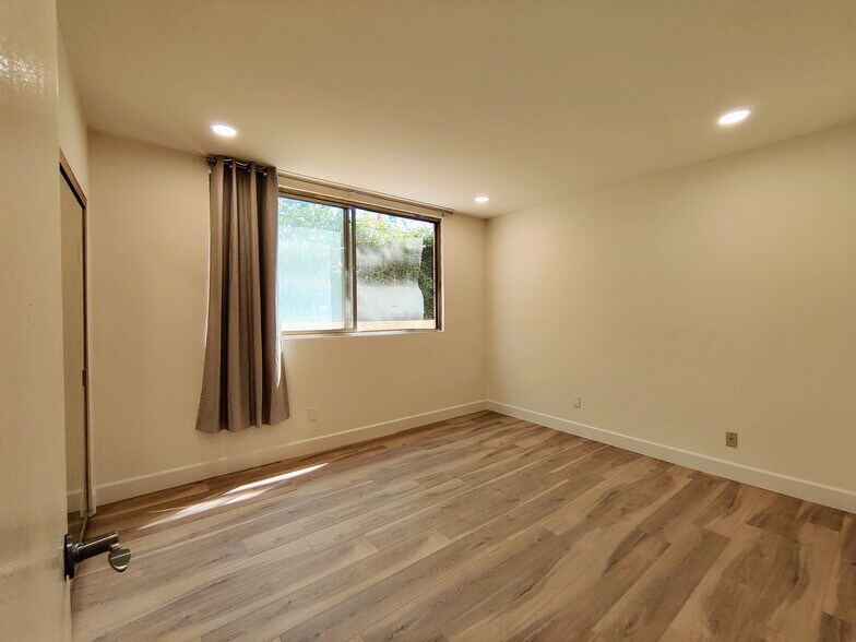 Bedroom 1 w/large window - 1300 Midvale Ave