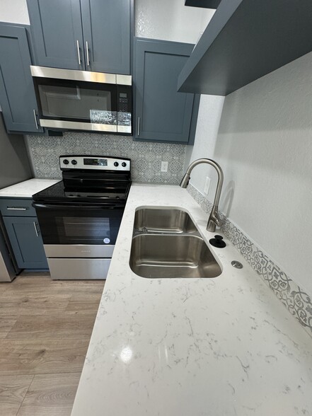 Quartz Countertop & Garbage Disposal Button - 754 Delmar St