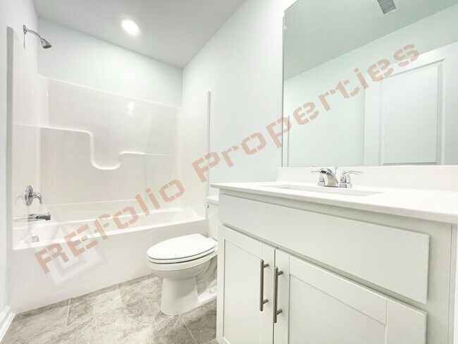 Building Photo - Brand New 3 Story, 4 bedroom, 3.5 bathroom Townhome Featuring a 1st floor Guest Suite, 2 Car Gara...