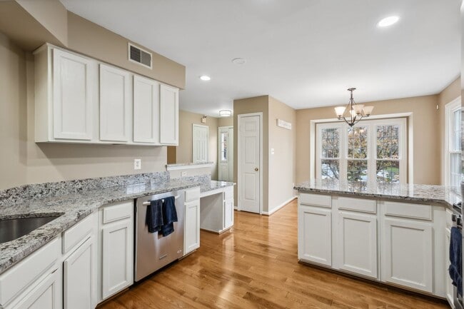 Building Photo - Modern Brick End-Unit Townhome with Stunning Upgrades and Serene Wooded Views