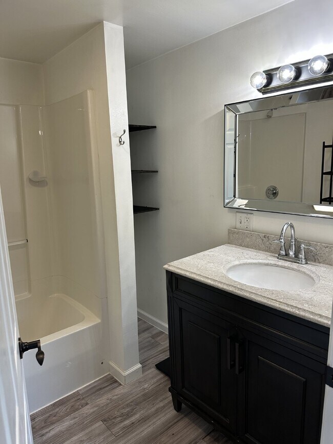 Building Photo - Enjoy an open floor plan in a prime location next to the bus line.