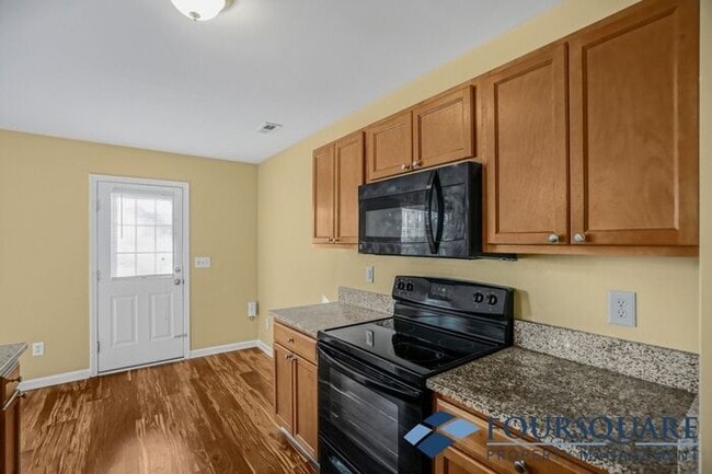 Building Photo - Charming 3-Bedroom Townhome with First-Floor Suite & Off-Street Parking – Near Capital Blvd & I-440