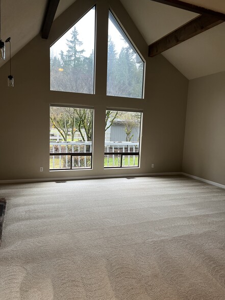 large living room with vaulted ceiling makes home feel large - 21020 SE 358th St