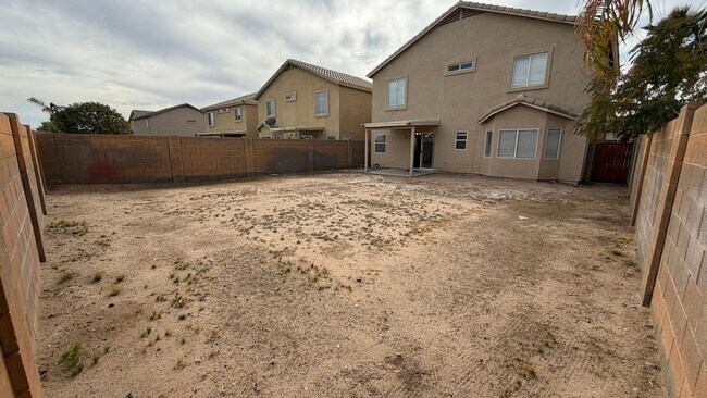 Building Photo - Two Story Home with NEW tile and a large backyard!