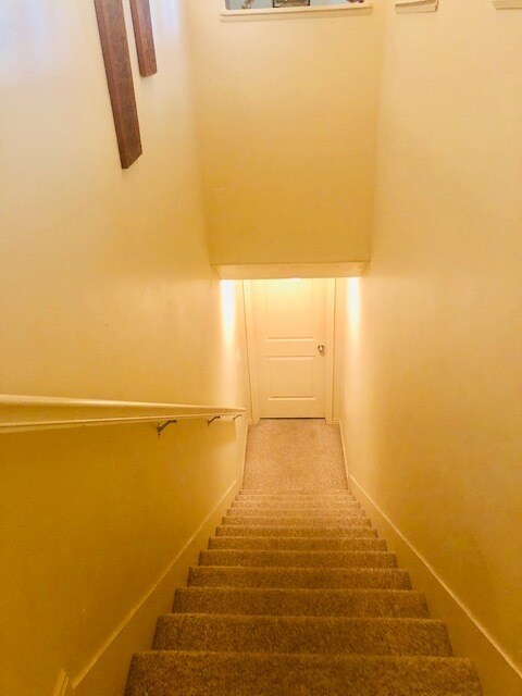 Going down staircase to apartment - 11769 S Sun Tea Way
