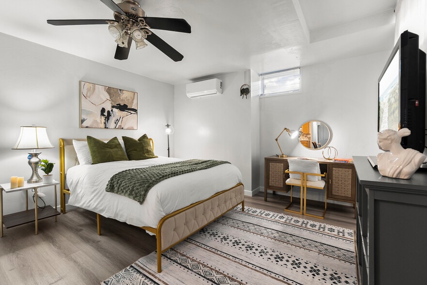 Work and unwind! This bedroom features a cozy workspace for productivity. - 4989 Randlett Dr