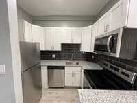 Building Photo - GORGEOUS 2/1 -  RENOVATED! Stainless, Granite, In Unit W/D