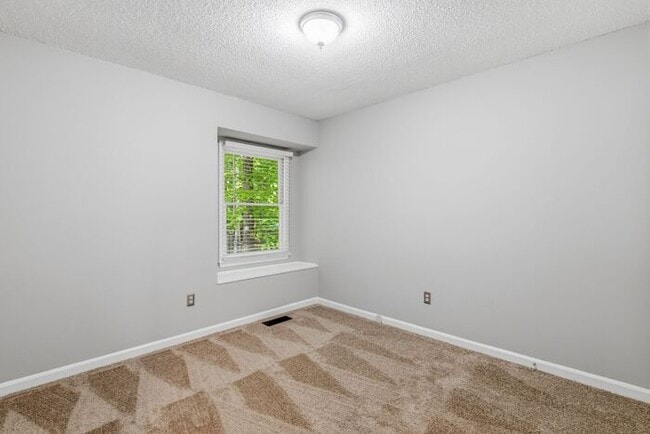 Building Photo - NW - Updated Home with Granite Counter-tops, Fire Place, Deck, Storage Building, Garage!