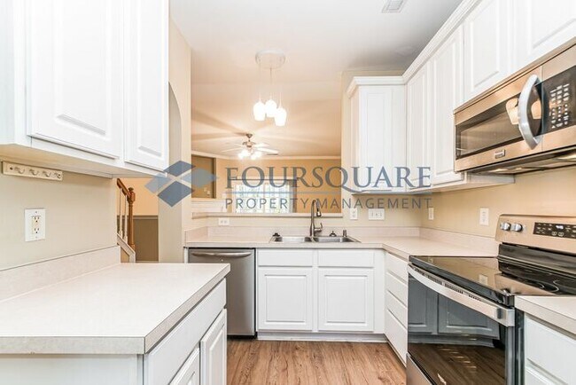 Building Photo - Spacious 2-Bed / 3.5-Bath Townhome with Hardwood Floors, Lower-Level Bonus Room & Private Outdoor...