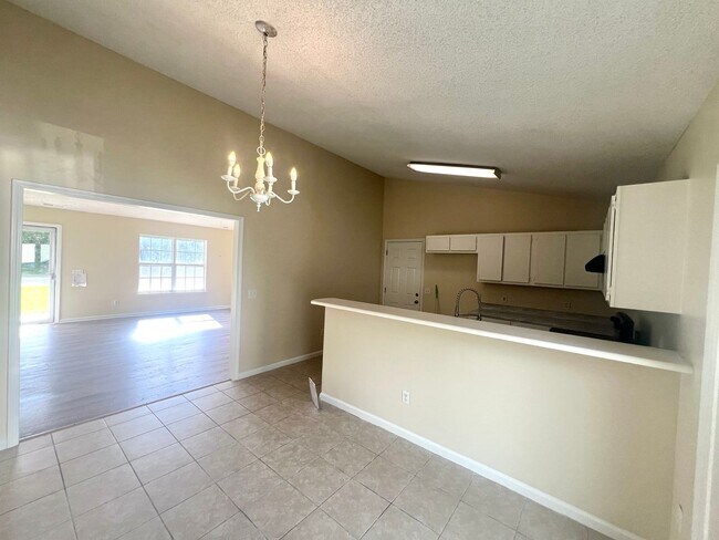 Building Photo - Freshley Painted! Updated Flooring! Pets o...