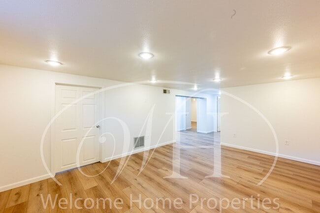 Building Photo - Spacious 5 Bedroom Home with Fenced Yard & Covered Parking