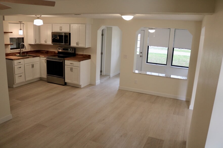Family style kitchen opening directly to dining and seating areas. - 33 63rd St