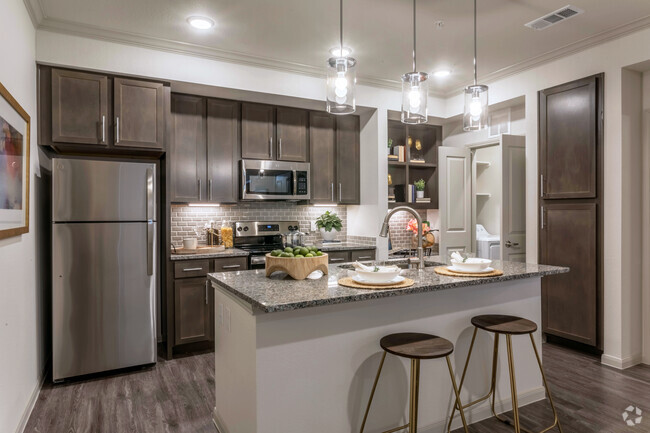 Kitchen, Built-In Desk, and Laundry Room - Seville at Clay Crossing