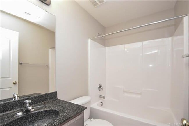 Building Photo - 4 BR/2.5BA  Community Pool | Fenced backyard!