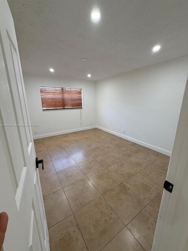 Building Photo - 10701 Royal Palm Blvd