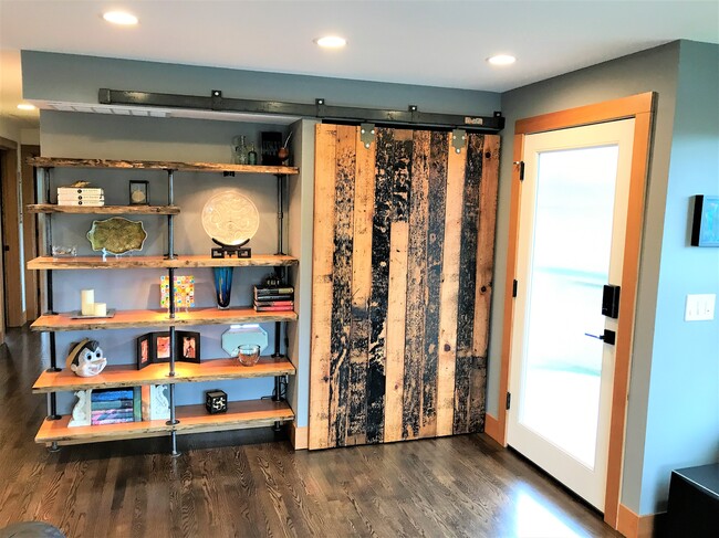 Entry with closet and custom built-in shelves - 6549 40th Ave NE