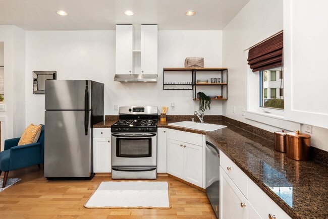 Building Photo - A Quiet Retreat with Parking, Patio, and City Proximity