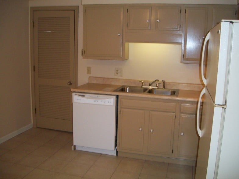 Separate laundry room next to kitchen with extra storage - 502 Mercer Rd
