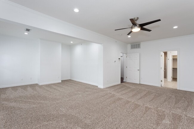 Building Photo - Gorgeous Mediterranean-style condo located...
