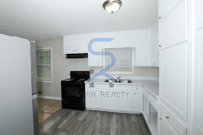 Building Photo - Timeless All-Electric Ranch Charm in a Vibrant, Peaceful Corner of South River Gardens