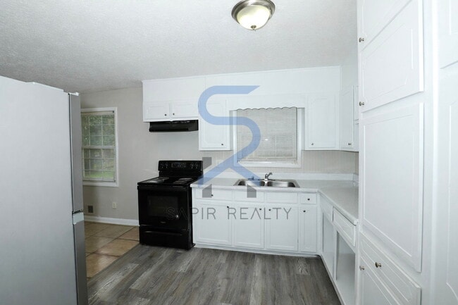 Building Photo - Timeless Ranch Charm in a Vibrant, Peaceful Corner of South River Gardens