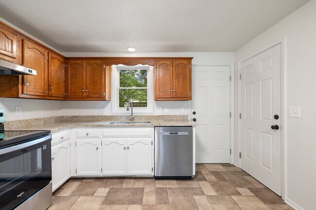 Building Photo - Charming Updated Home with 1-Car Garage, Fenced Backyard & Modern Finishes